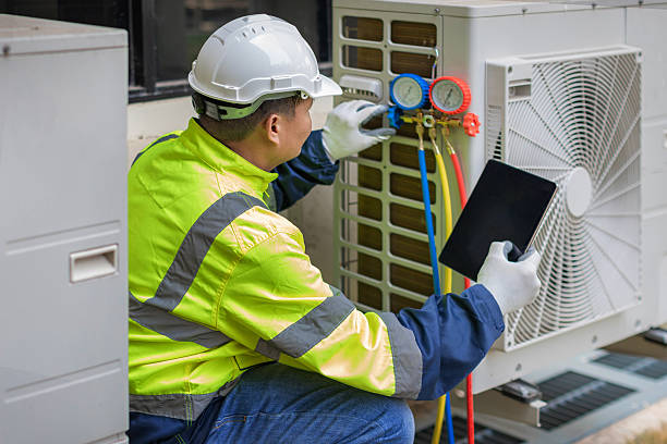 Professional Heat Pump Repair technician working in Slidell, TX